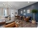 Living room with a statement wall and comfortable seating at 1011 Swamp Harrier Ave, Ravenel, SC 29470