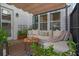 Relaxing patio with seating area, pergola, and lush greenery at 1011 Swamp Harrier Ave, Ravenel, SC 29470
