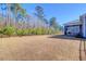 Large backyard with privacy fence and firepit at 1040 Wading Point Blvd, Huger, SC 29450