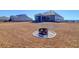 Backyard with firepit and home view at 1040 Wading Point Blvd, Huger, SC 29450