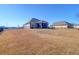Large backyard with firepit and screened porch at 1040 Wading Point Blvd, Huger, SC 29450