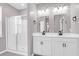 Main bathroom with double vanity and a large shower at 1040 Wading Point Blvd, Huger, SC 29450