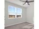 Well-lit bedroom with carpeting and a large window overlooking a lake at 1040 Wading Point Blvd, Huger, SC 29450