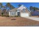 Charming single-Gathering home featuring stone accents, a two-car garage, and well-maintained landscaping at 1040 Wading Point Blvd, Huger, SC 29450