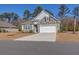 Two-story home with stone and siding at 1040 Wading Point Blvd, Huger, SC 29450