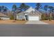 Two-story home with stone and siding at 1040 Wading Point Blvd, Huger, SC 29450