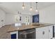 Modern kitchen island with granite countertop and stainless steel sink at 1040 Wading Point Blvd, Huger, SC 29450