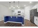 Modern kitchen with stainless steel appliances and a blue island at 1040 Wading Point Blvd, Huger, SC 29450