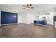 Open living area with hardwood floors and blue accent wall at 1040 Wading Point Blvd, Huger, SC 29450