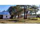 Backyard view showing part of house and surrounding trees at 12240 Green Pond Hwy, Green Pond, SC 29446