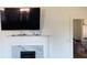 White mantel fireplace with a marble hearth and a large TV above it at 12240 Green Pond Hwy, Green Pond, SC 29446