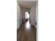Long hallway with light brown wood flooring and doors leading to other rooms at 12240 Green Pond Hwy, Green Pond, SC 29446