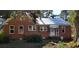 Brick home with metal roof and a screened porch at 12240 Green Pond Hwy, Green Pond, SC 29446