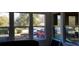 Sunroom with view of yard and parked vehicles at 12240 Green Pond Hwy, Green Pond, SC 29446