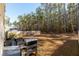 Spacious backyard with deck, grill, and wooded privacy at 135 Sunray Ln, Summerville, SC 29486