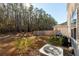 Private backyard with wooded area, deck, and grill at 135 Sunray Ln, Summerville, SC 29486