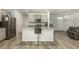 Kitchen island with granite countertop and black bar stool at 135 Sunray Ln, Summerville, SC 29486