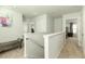 Upstairs hallway with neutral walls and carpet, offering access to bedrooms at 135 Sunray Ln, Summerville, SC 29486