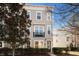 Tan three-story townhome with a black balcony at 1586 Bluewater Way, Charleston, SC 29414