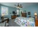 Charming bedroom with a floral quilt and a ceiling fan at 1700 Congressional Blvd, Summerville, SC 29483