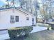 Backyard with small patio and green bushes at 202 Briarwood St, Walterboro, SC 29488