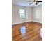 Hardwood floor bedroom with window and ceiling fan at 202 Briarwood St, Walterboro, SC 29488