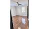 Bright bedroom with hardwood floors and ceiling fan at 202 Briarwood St, Walterboro, SC 29488