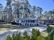 Charming ranch home with a metal roof, carport, and spacious front porch at 202 Briarwood St, Walterboro, SC 29488