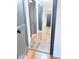 A long hallway with wood-look flooring and access to multiple rooms at 202 Briarwood St, Walterboro, SC 29488