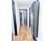 Hallway with dark hardwood floors and HVAC unit at 202 Briarwood St, Walterboro, SC 29488