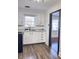 Updated kitchen with white cabinets and new flooring at 202 Briarwood St, Walterboro, SC 29488