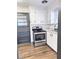 Renovated kitchen featuring white cabinets and new flooring at 202 Briarwood St, Walterboro, SC 29488