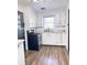 Updated kitchen with stainless steel appliances and new flooring at 202 Briarwood St, Walterboro, SC 29488