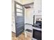 Bright kitchen with access to sunroom and updated flooring at 202 Briarwood St, Walterboro, SC 29488