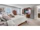 Main bedroom with large bed, dresser, and a view of the bathroom at 240 Godwit Dr, Summerville, SC 29486