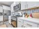 Modern kitchen with stainless steel appliances and white cabinets at 240 Godwit Dr, Summerville, SC 29486
