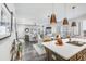 Open concept kitchen and living area with island, stainless steel appliances, and hardwood floors at 240 Godwit Dr, Summerville, SC 29486