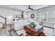 Relaxing living room featuring a comfortable sofa, ottoman, and large windows at 240 Godwit Dr, Summerville, SC 29486