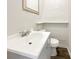 Small bathroom with white vanity, toilet and exposed brick feature wall at 3 Tommy Cir, Goose Creek, SC 29445