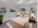 Cozy bedroom with light wood platform bed and two windows at 3 Tommy Cir, Goose Creek, SC 29445