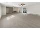 Large Gathering room with neutral carpet, brick accent wall, and sliding doors at 3 Tommy Cir, Goose Creek, SC 29445