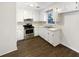 Classic kitchen with white cabinets, stainless steel appliances, and dark floors at 3 Tommy Cir, Goose Creek, SC 29445