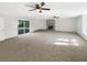 Large living area with fireplace and sliding glass doors at 3 Tommy Cir, Goose Creek, SC 29445