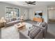Bright living room with gray couches, coffee table, and large window at 3 Tommy Cir, Goose Creek, SC 29445