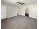 Spacious living room with neutral carpeting and view into kitchen at 3 Tommy Cir, Goose Creek, SC 29445