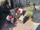 Landscaped backyard with patio furniture and colorful plants at 3001 Parkwest Boulevard, Mount Pleasant, SC 29466