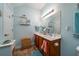 Double vanity bathroom with light teal walls and coral towels at 3001 Parkwest Boulevard, Mount Pleasant, SC 29466