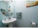 Small half bathroom with pedestal sink and beach themed decor at 3001 Parkwest Boulevard, Mount Pleasant, SC 29466