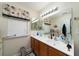 Double vanity bathroom with updated lighting and mirror at 3001 Parkwest Boulevard, Mount Pleasant, SC 29466