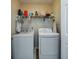 Functional laundry room with washer, dryer, and shelving at 3001 Parkwest Boulevard, Mount Pleasant, SC 29466